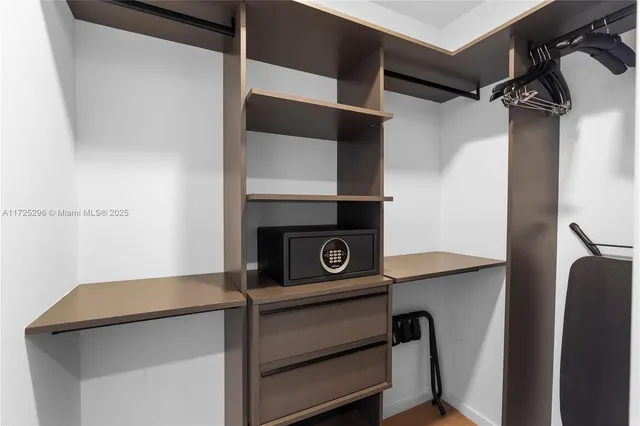 a view of a hallway with washer and dryer