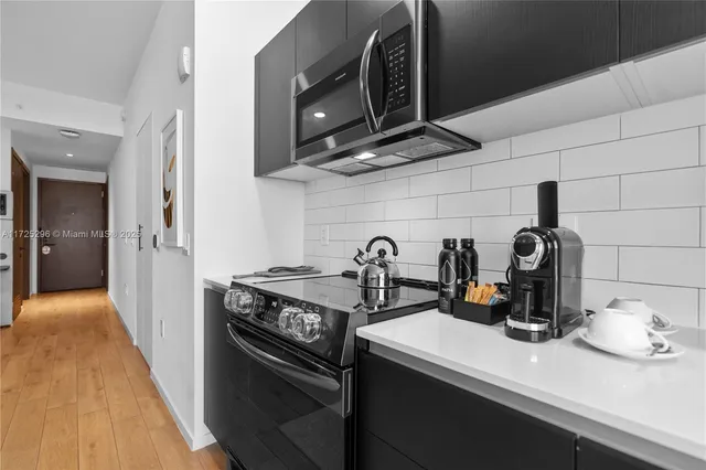 a view of a chair and tables in the balcony