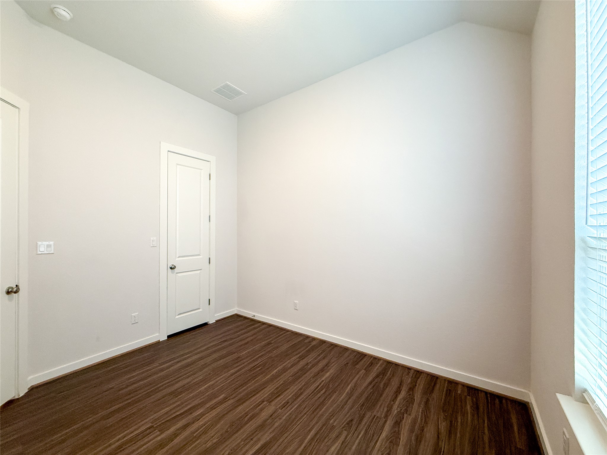 249 Heartleaf Road San Marcos, TX 78666 - Photo 22 of 38 Warm wood-tone flooring defines this versatile space, ready for your personalized touch.