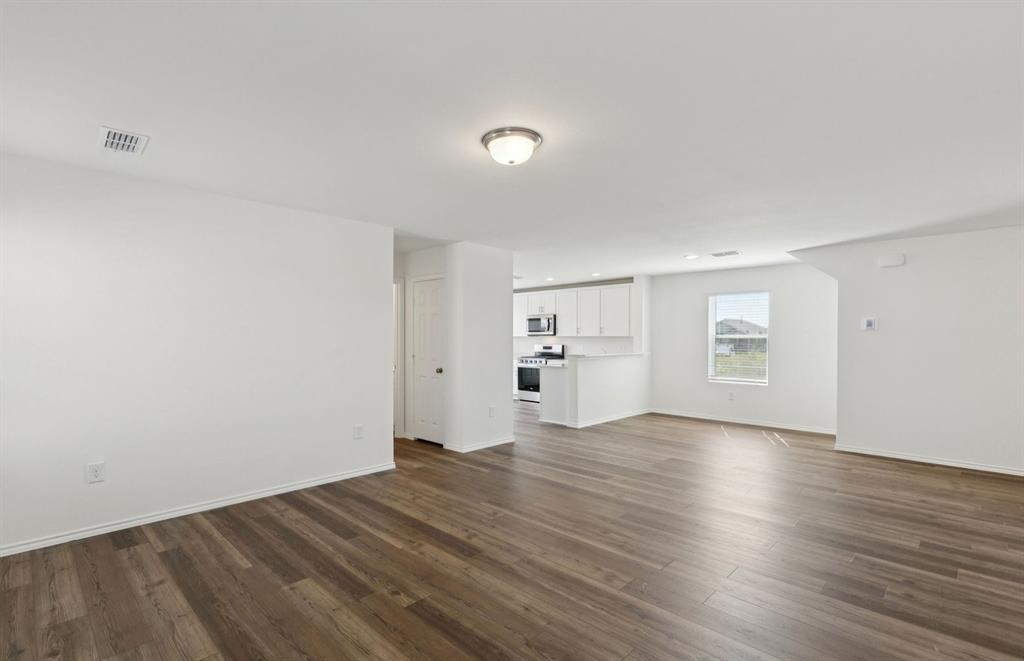 828 Springwell Drive Princeton, TX 75407 - Photo 11 of 17 *Floorplan representation, not actual home - Dining area off kitchen with large windows