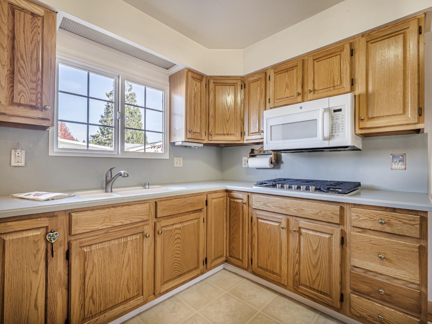 225 Mt Hermon Road, Unit 37 Scotts Valley, CA 95066 - Photo 11 of 44 a kitchen with cabinets appliances a sink and a window