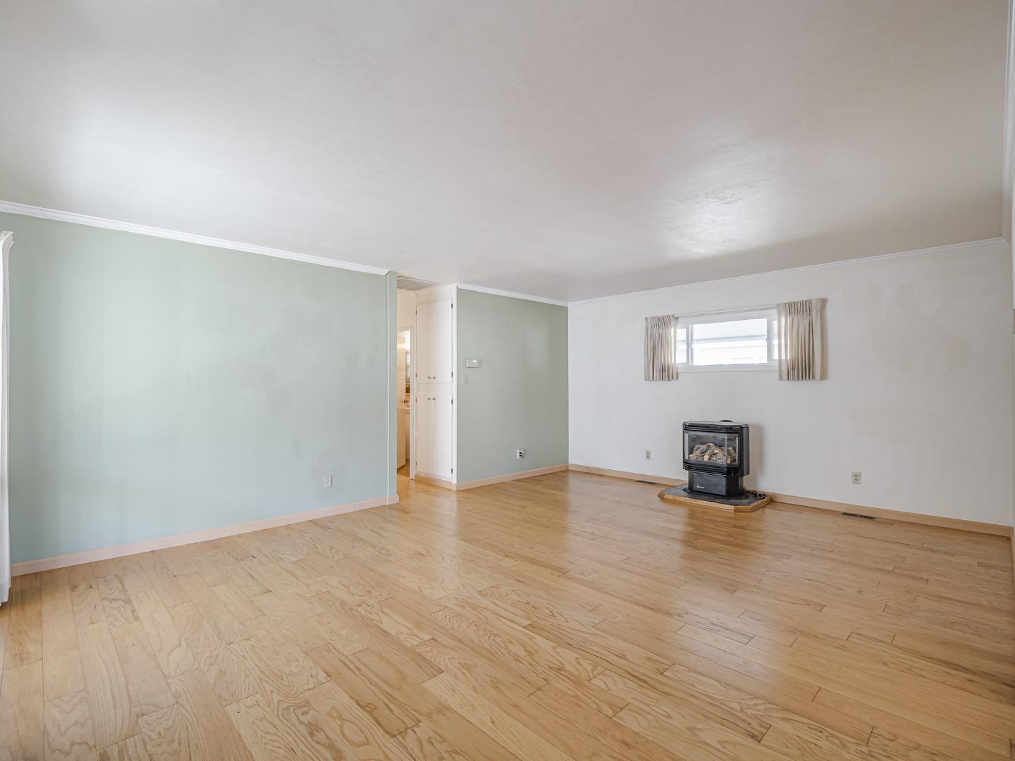 225 Mt Hermon Road, Unit 37 Scotts Valley, CA 95066 - Photo 8 of 44 a view of an empty room with wooden floor and a window