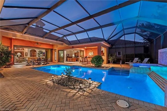 a view of a swimming pool with a patio
