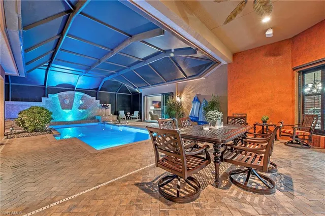 a view of a dinning table and chairs in the patio