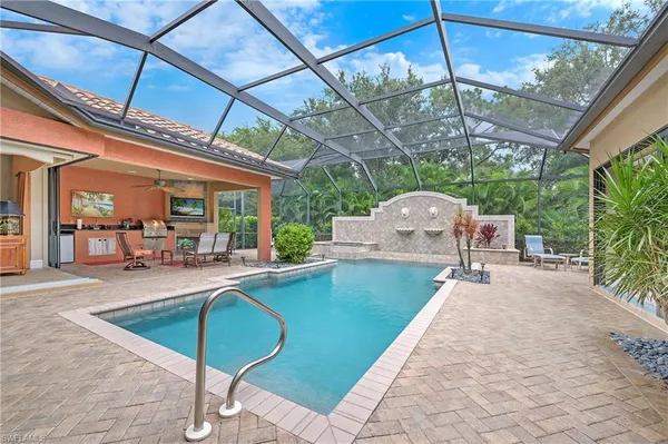 a view of a swimming pool with a patio