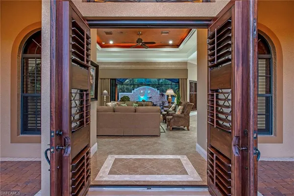 a view of living room with furniture and a fireplace
