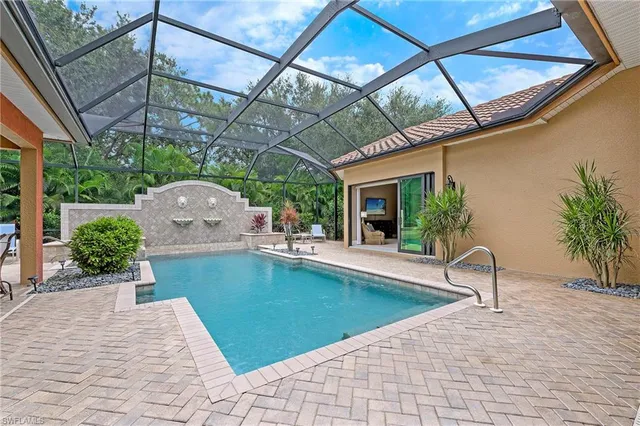 a view of a swimming pool with a patio