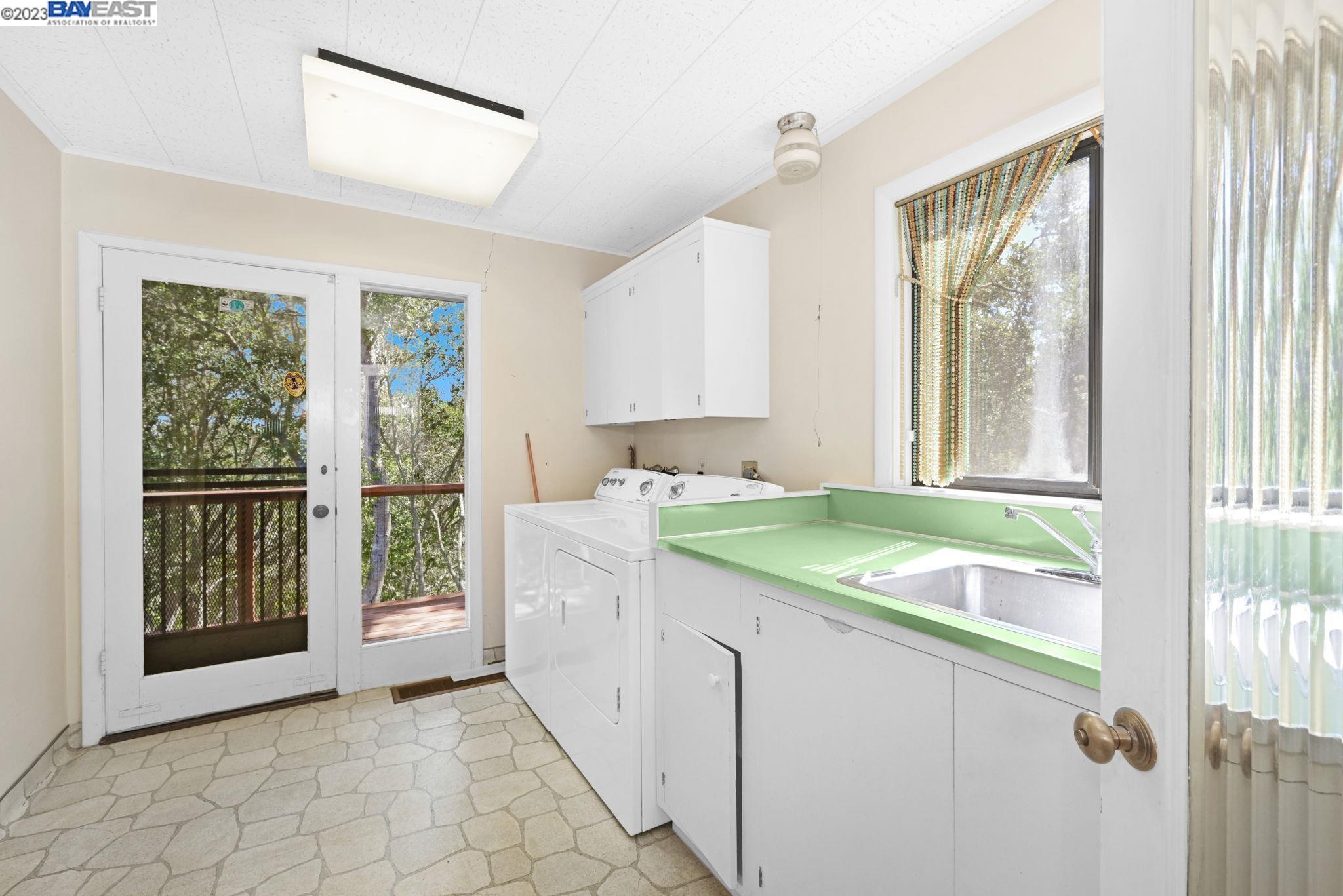 Undisclosed Address Orinda, CA 94563 - Photo 12 of 32 a bathroom with a granite countertop sink and a large window