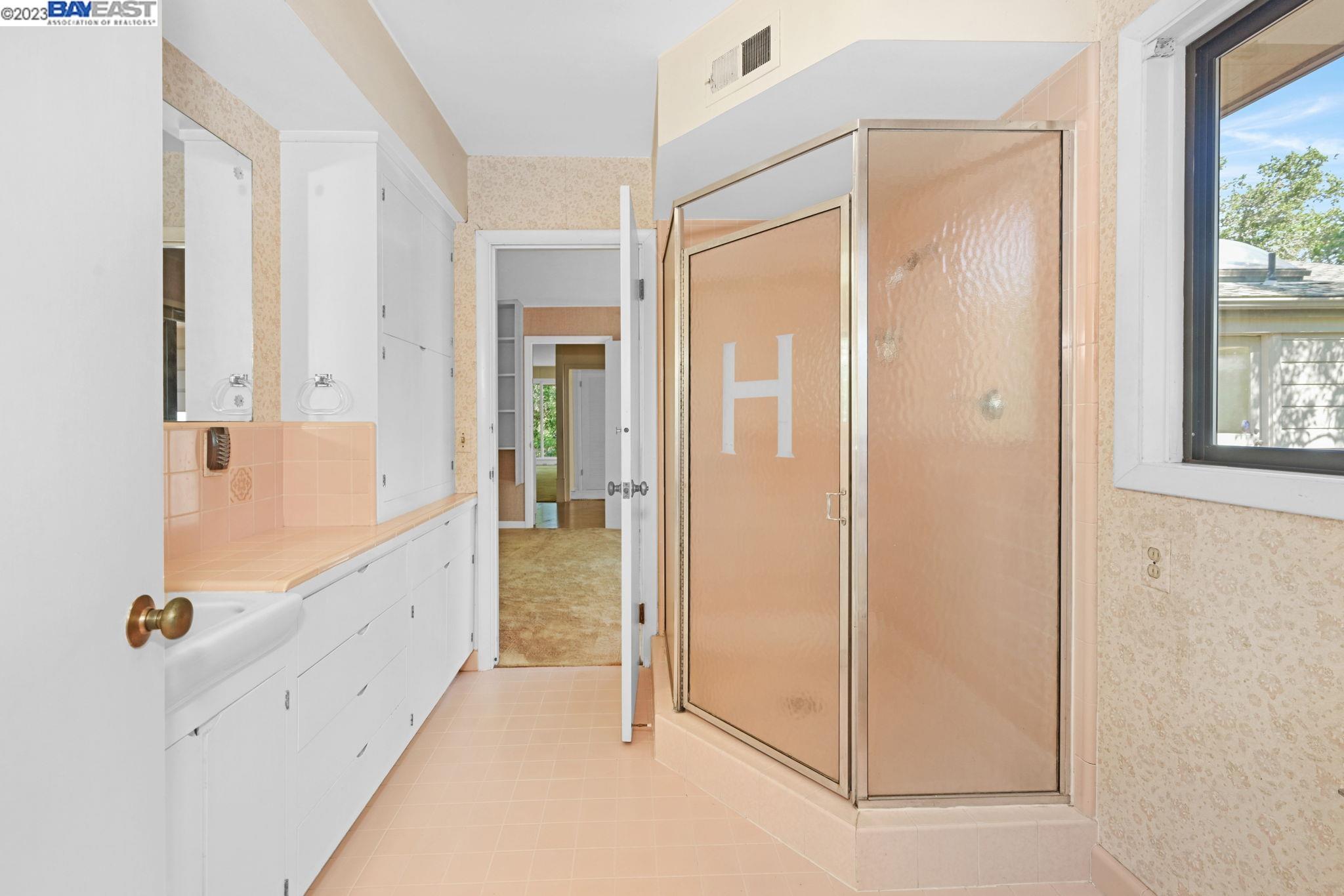 Undisclosed Address Orinda, CA 94563 - Photo 13 of 32 a bathroom with a glass shower door
