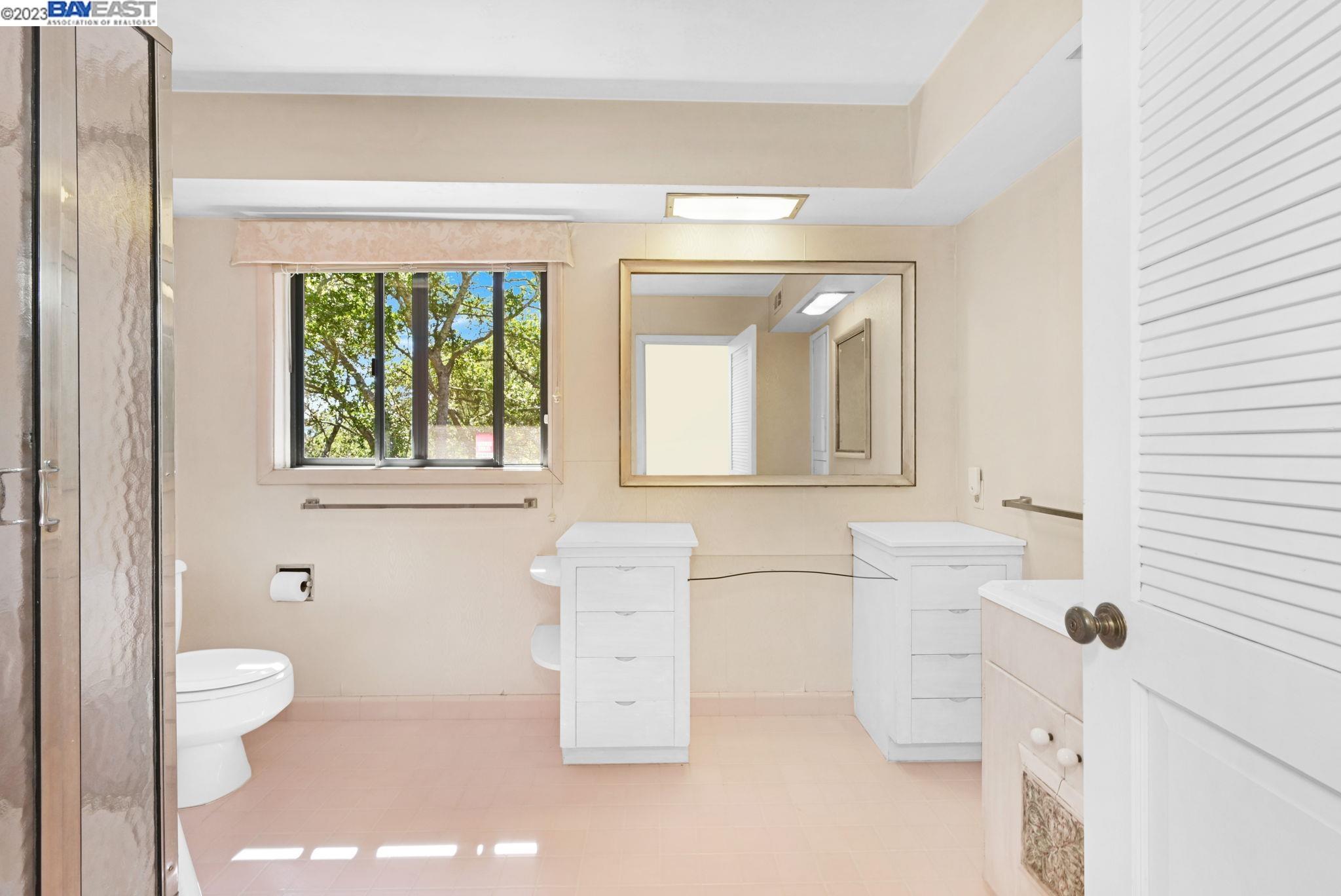 Undisclosed Address Orinda, CA 94563 - Photo 15 of 32 a bathroom with a toilet sink and mirror