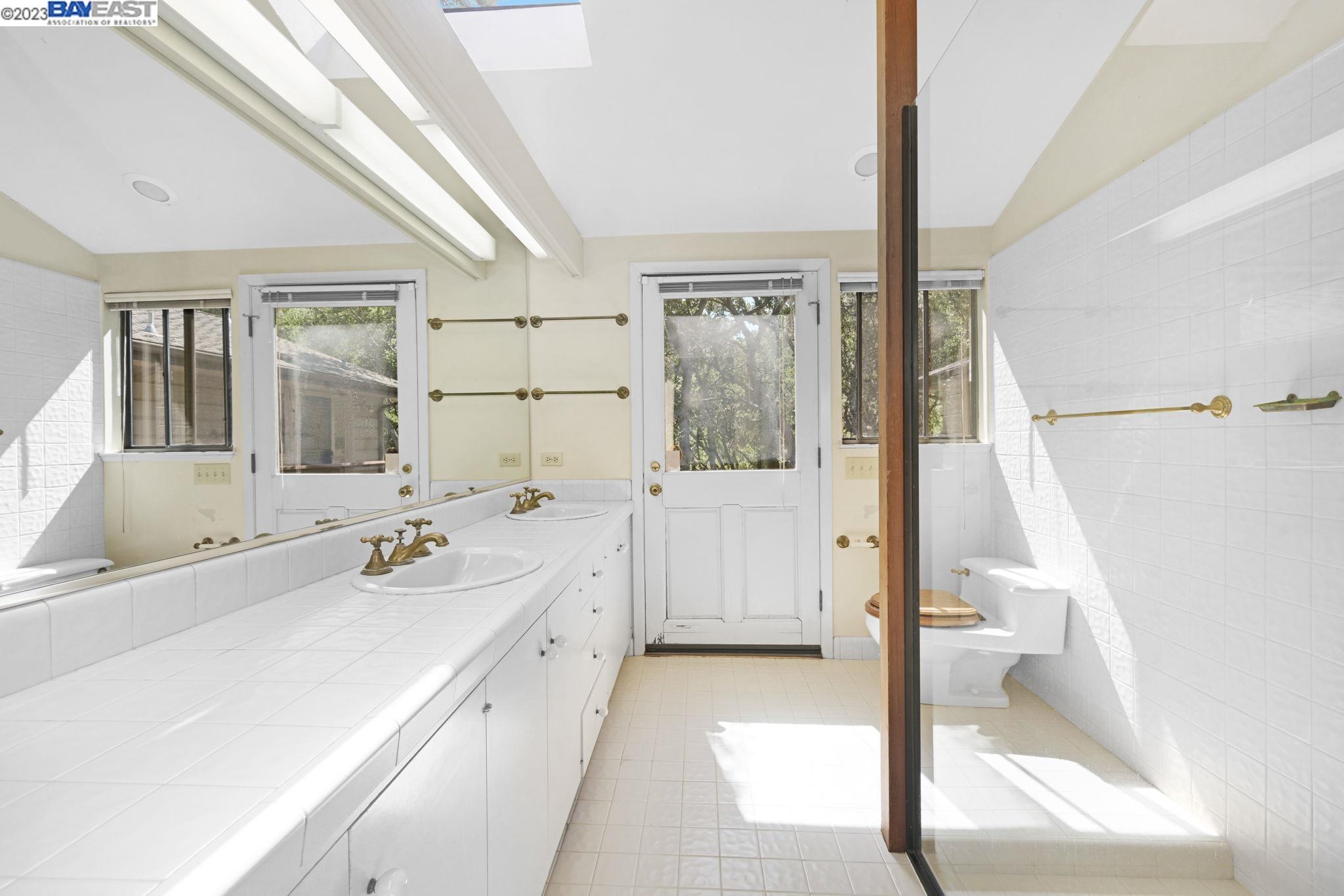 Undisclosed Address Orinda, CA 94563 - Photo 16 of 32 a spacious bathroom with a tub sink and mirror