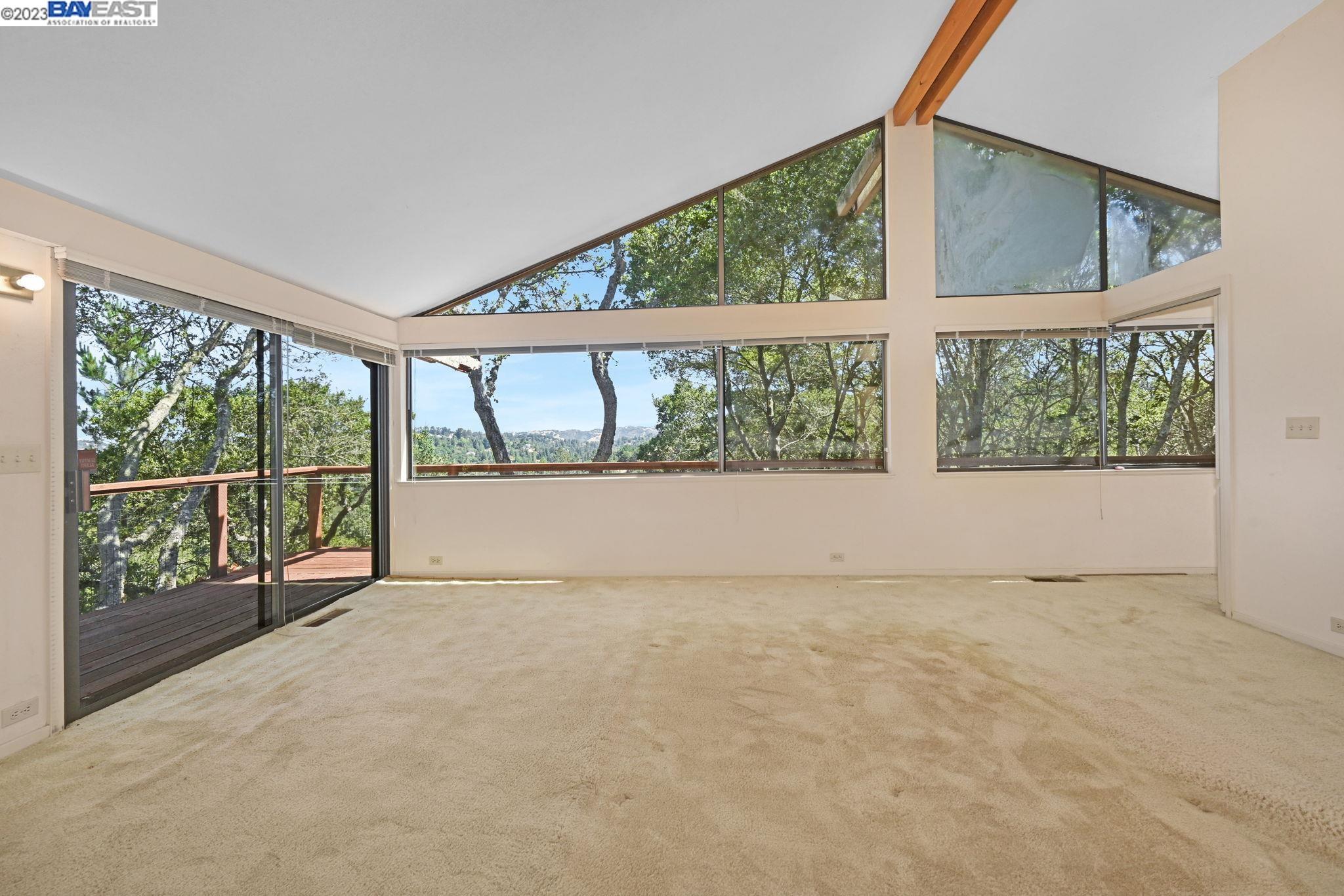Undisclosed Address Orinda, CA 94563 - Photo 17 of 32 an empty room with large windows