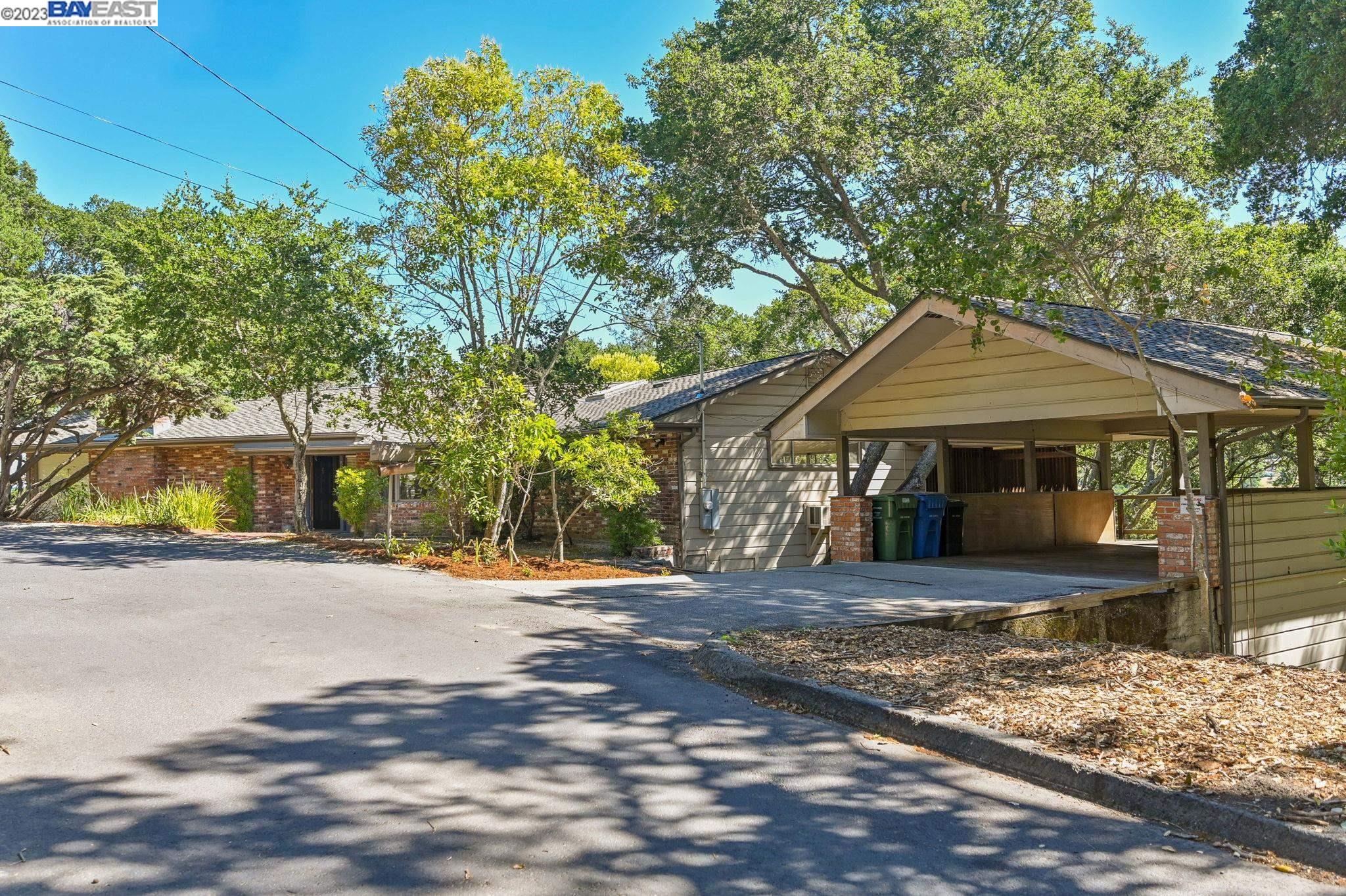 Undisclosed Address Orinda, CA 94563 - Photo 2 of 32 a front view of a house with a yard