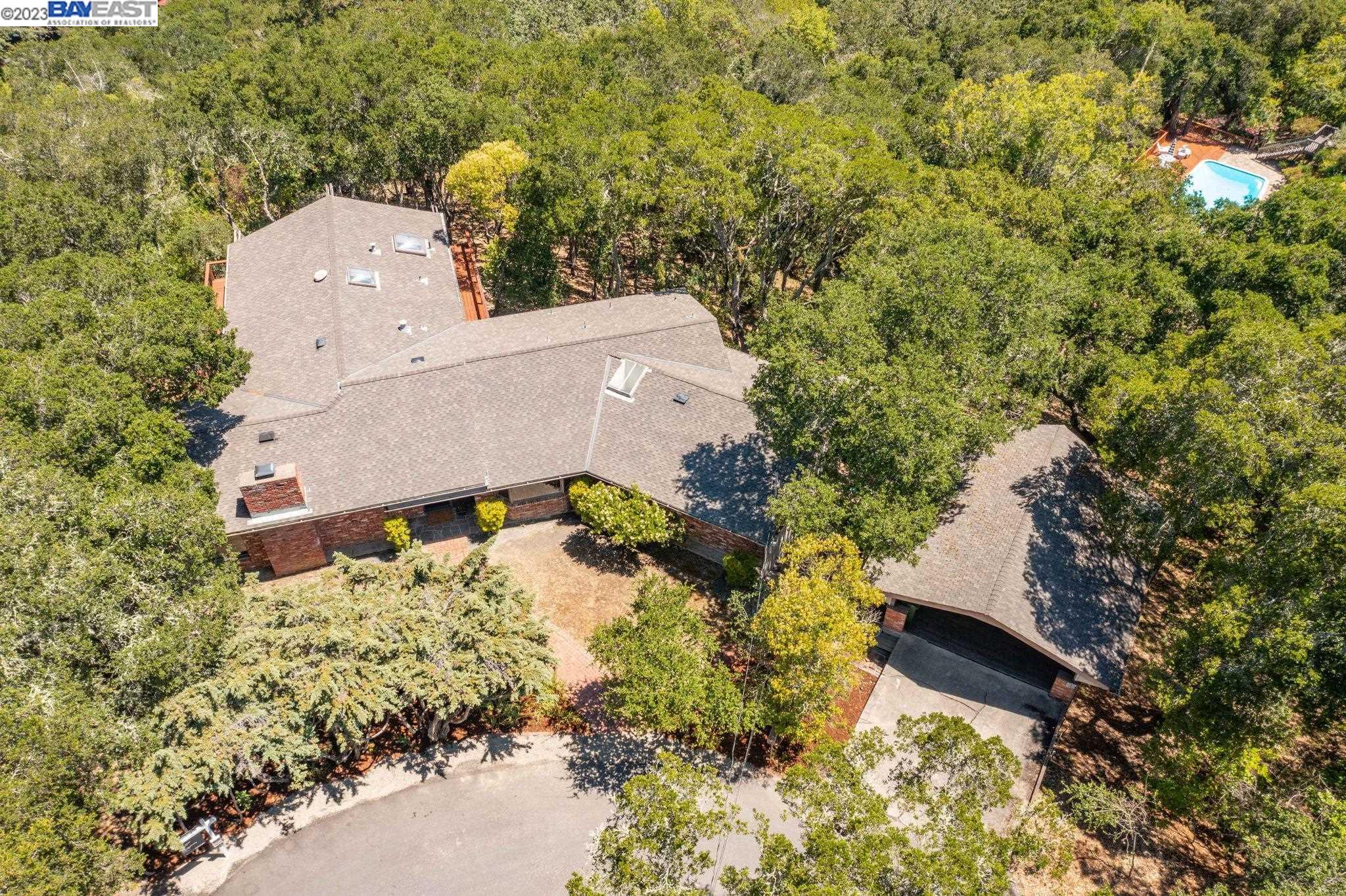 Undisclosed Address Orinda, CA 94563 - Photo 26 of 32 an aerial view of a house with a yard and trees all around