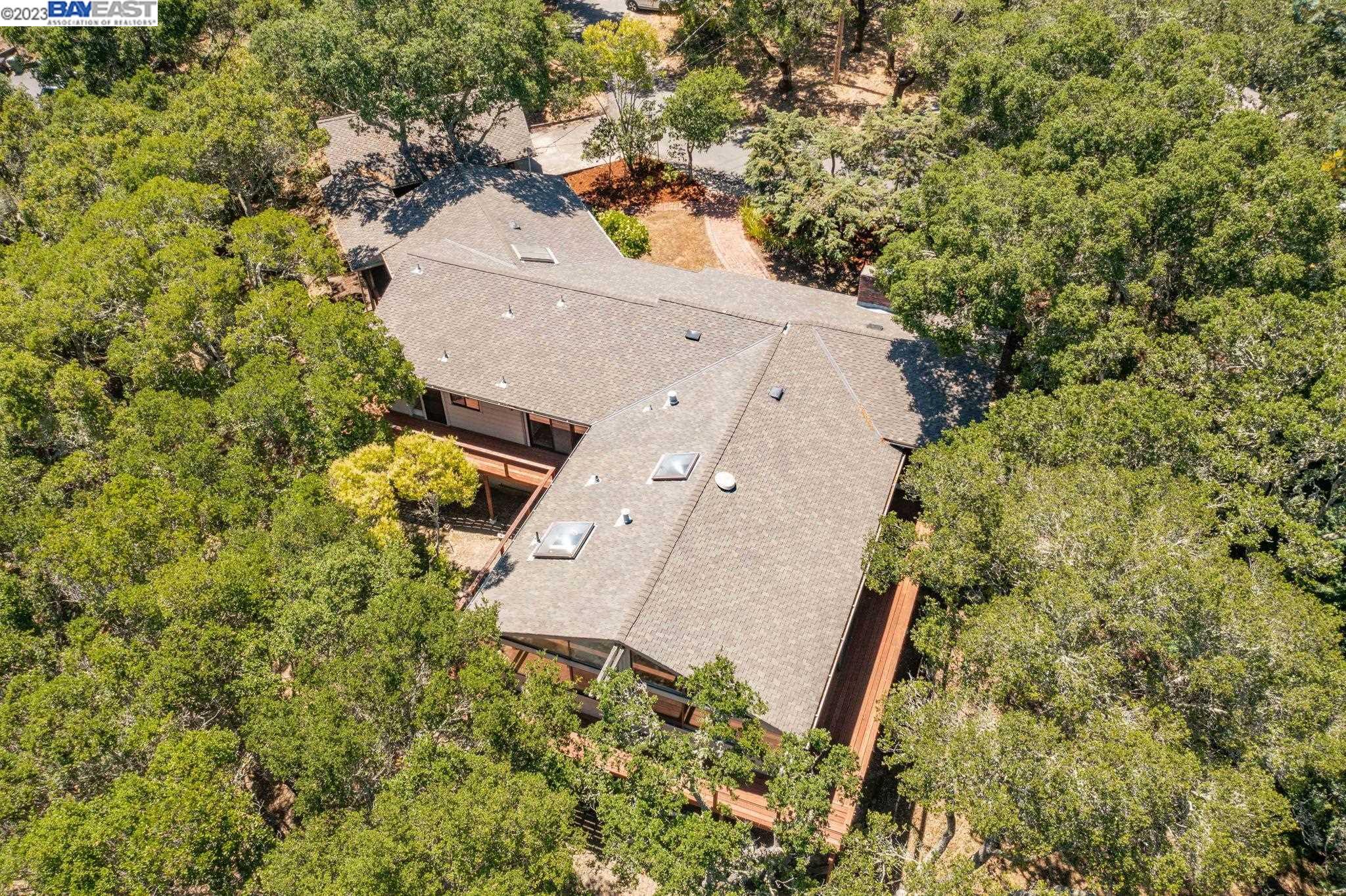 Undisclosed Address Orinda, CA 94563 - Photo 29 of 32 an aerial view of a house with a yard and large trees