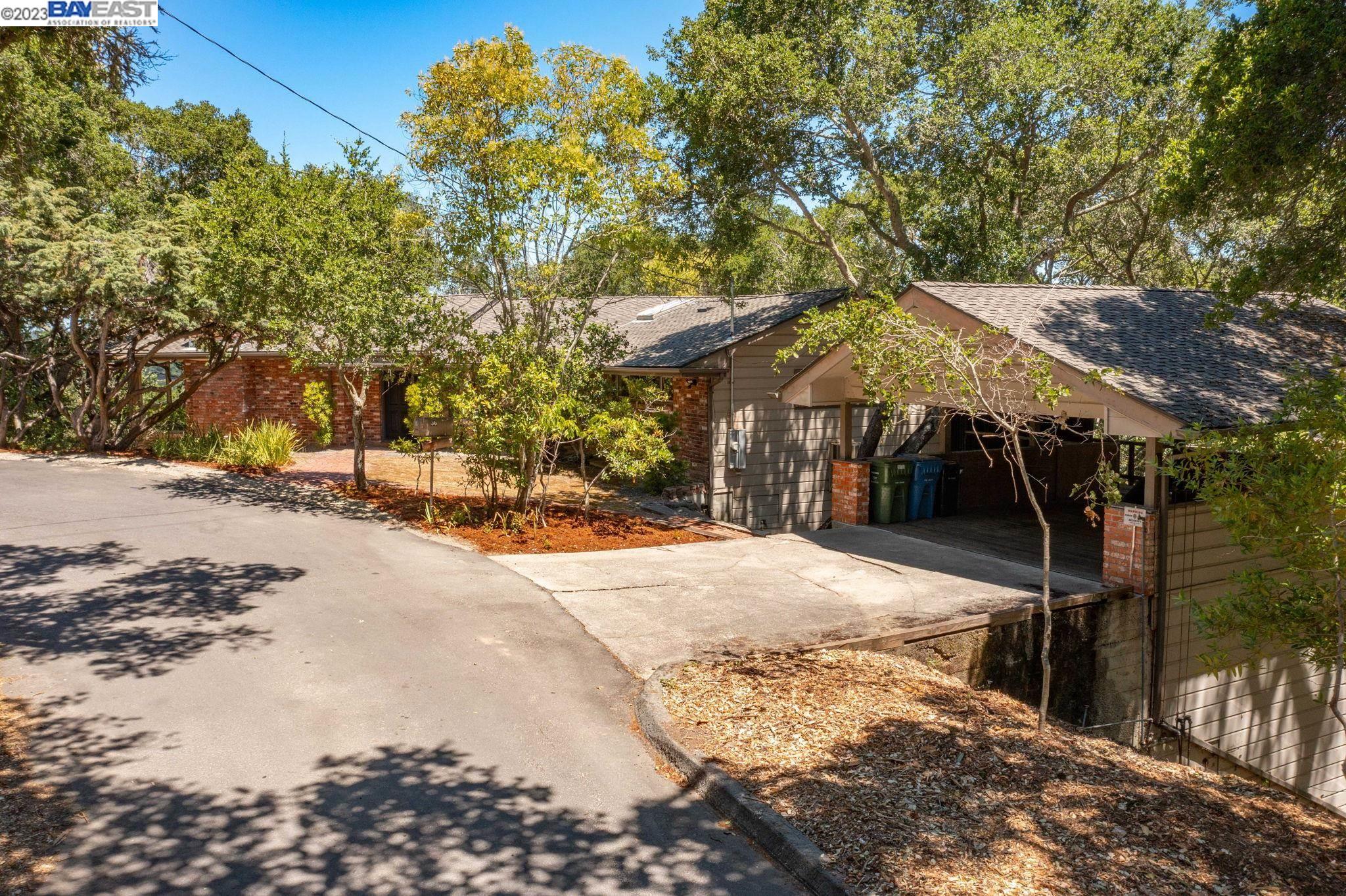 Undisclosed Address Orinda, CA 94563 - Photo 3 of 32 a view of a street with houses