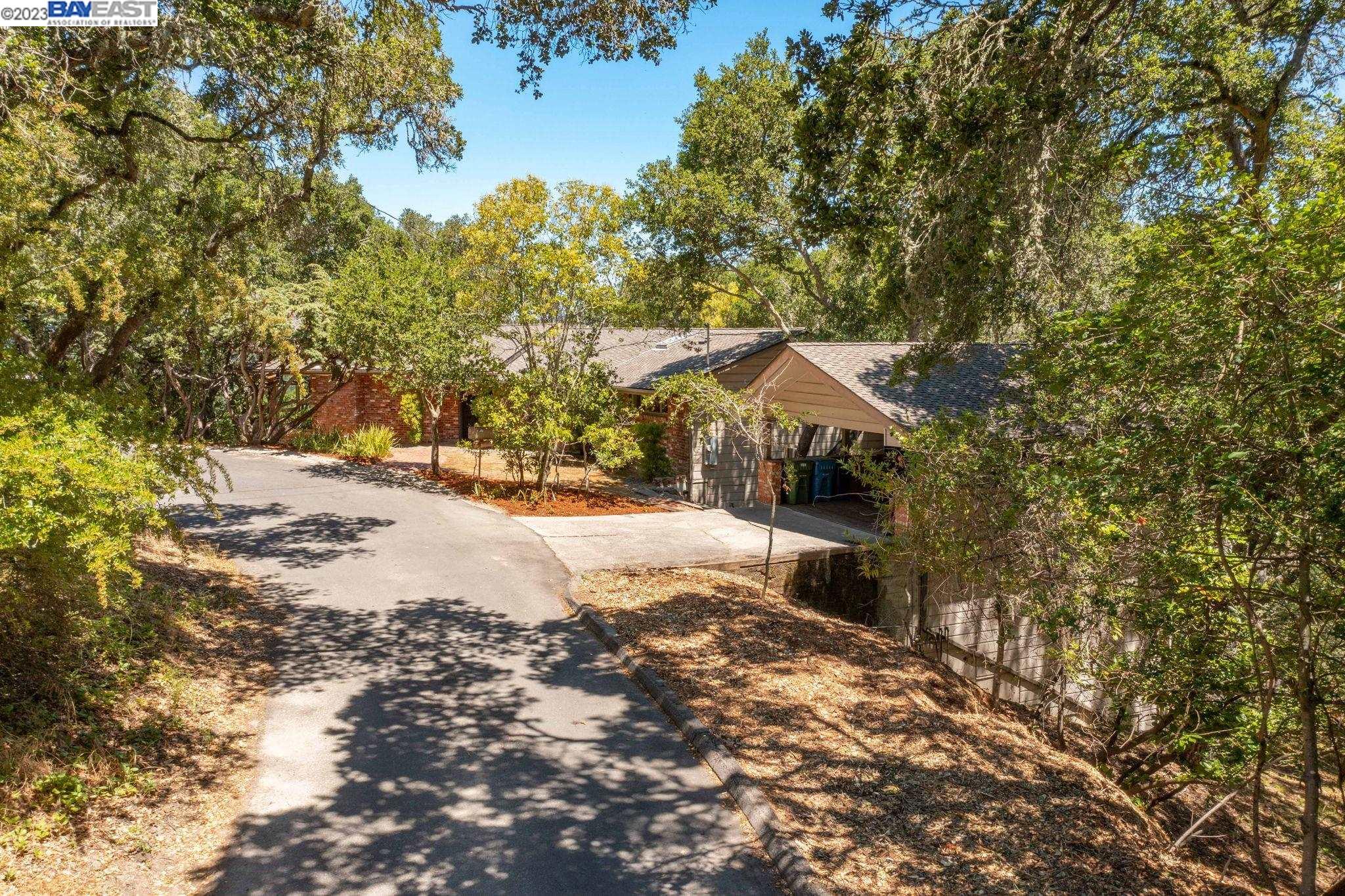 Undisclosed Address Orinda, CA 94563 - Photo 4 of 32 a view of a houses with a yard