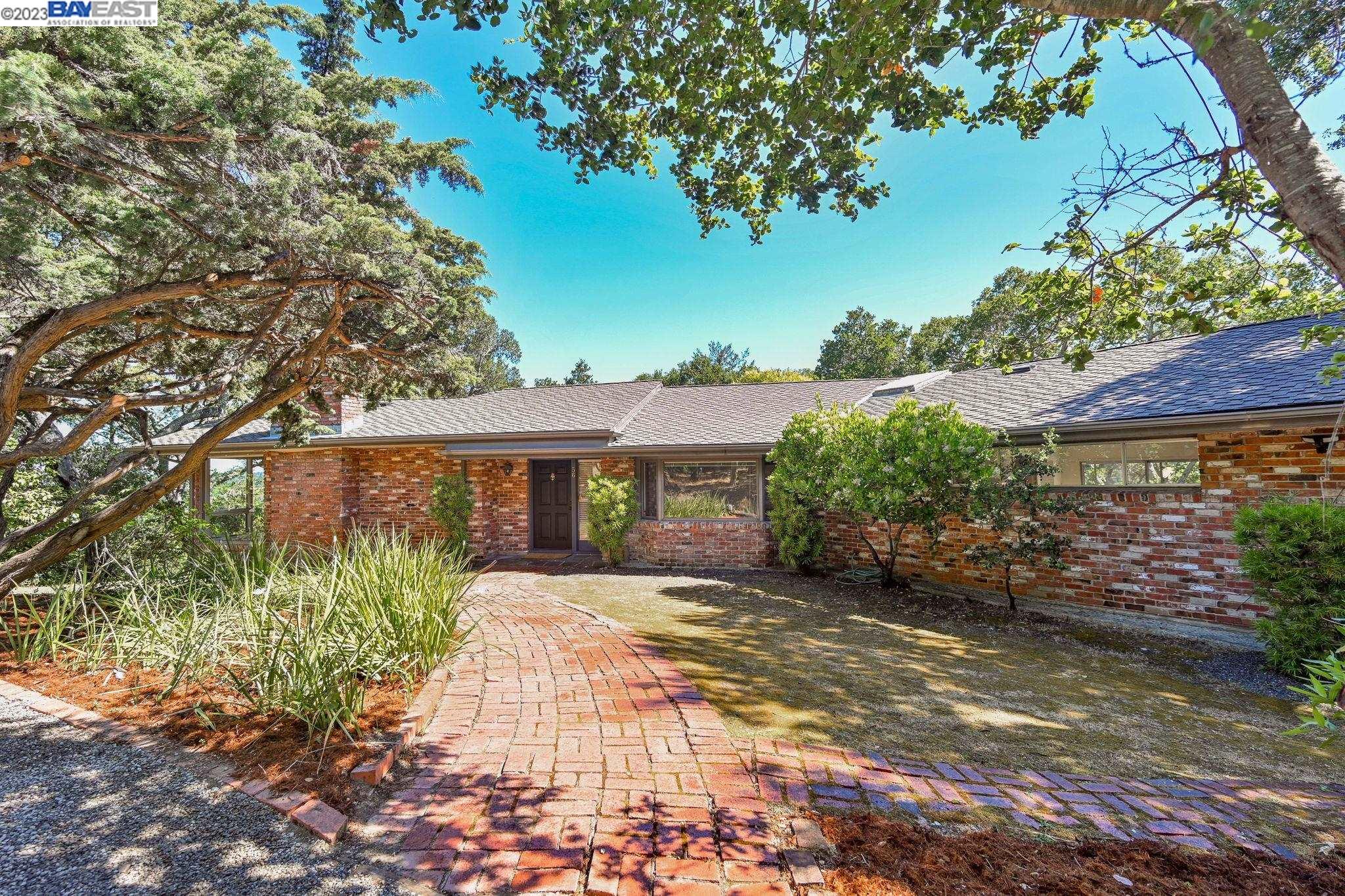 Undisclosed Address Orinda, CA 94563 - Photo 5 of 32 front view of a house with a garden