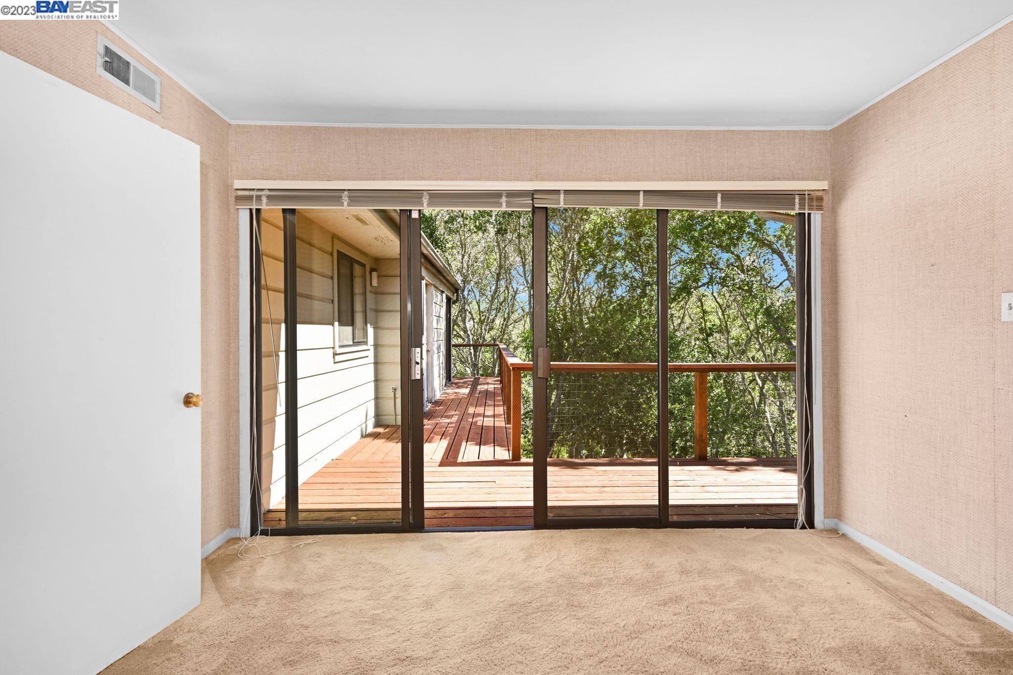 Undisclosed Address Orinda, CA 94563 - Photo 8 of 32 a view of a room with wooden floor and large windows