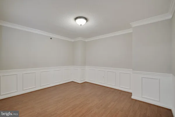 a view of a kitchen with wooden floor