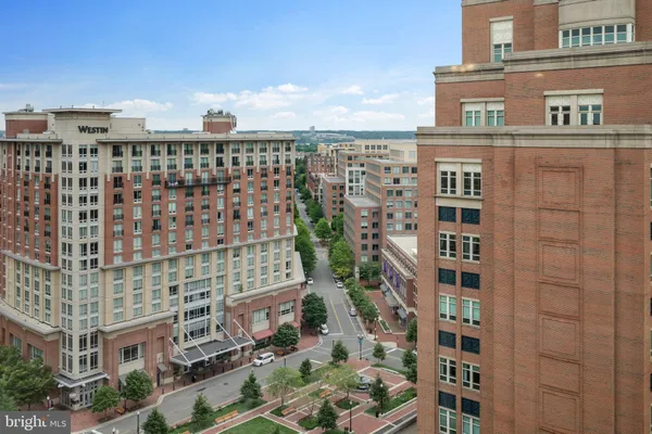 a bathroom with a sink vanity granite and a mirror