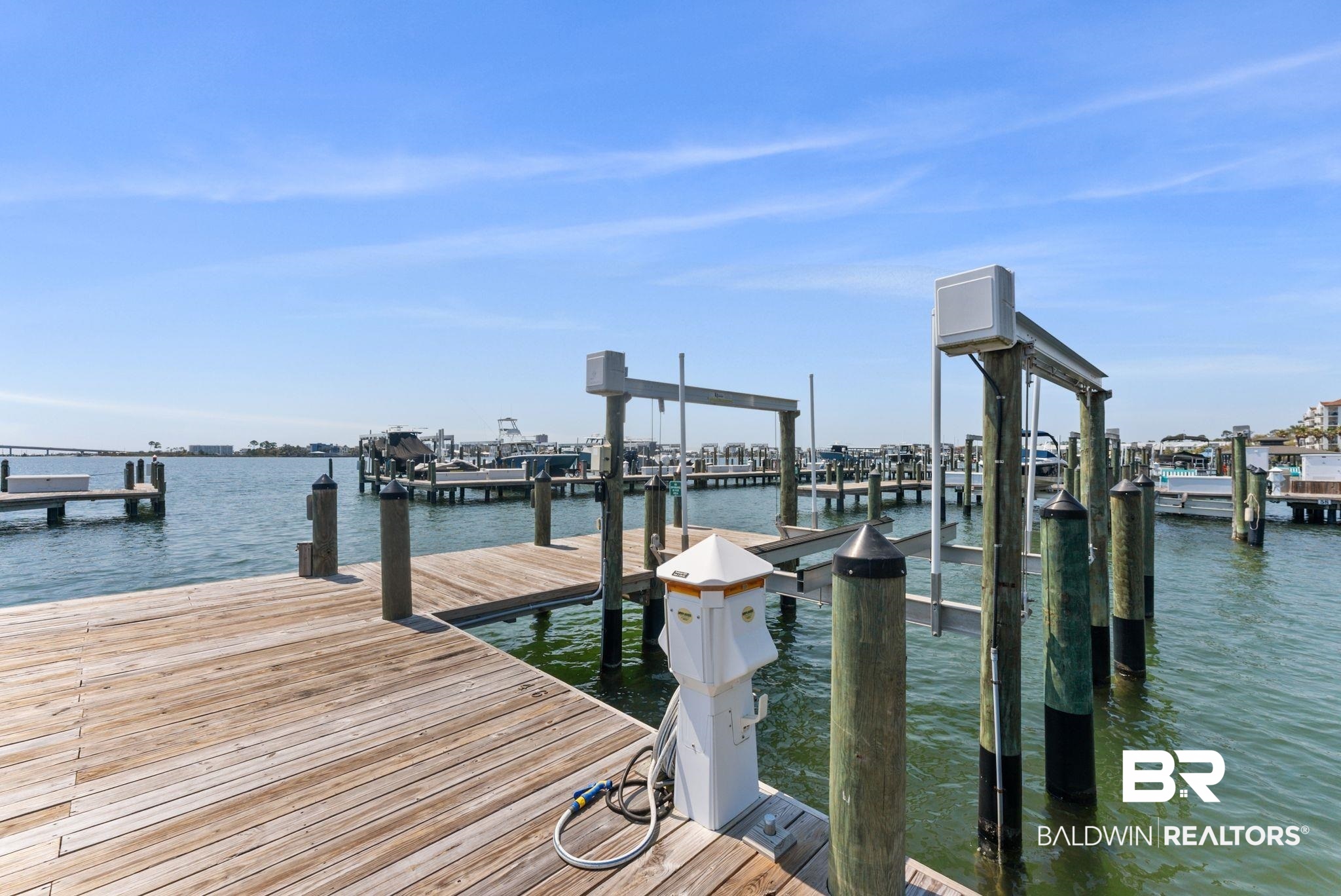 27580 Canal Road, Unit 1233 Orange Beach, AL 36561 - Photo 58 of 79 Dock area featuring a water view and boat lift