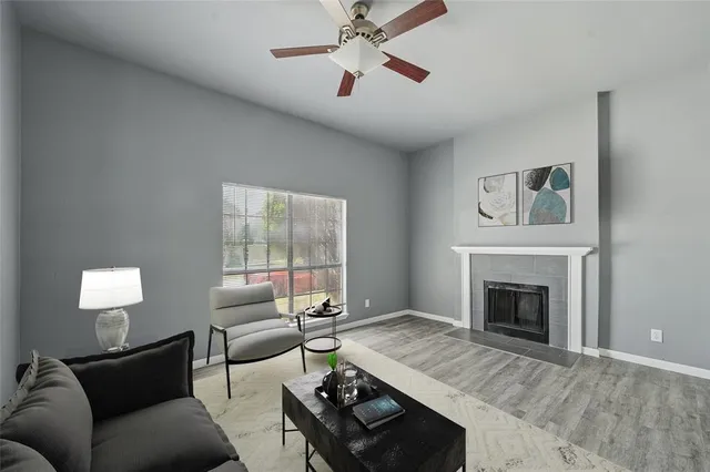 a living room with furniture and a fireplace