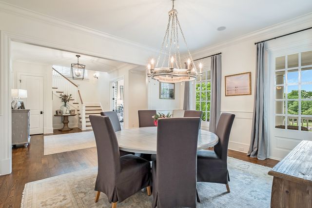 a living room with fireplace furniture and a flat screen tv