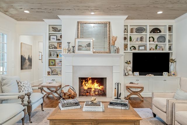 a kitchen with stainless steel appliances kitchen island granite countertop a stove a sink and a refrigerator