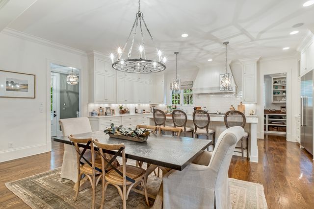 a view of kitchen with cabinets and window