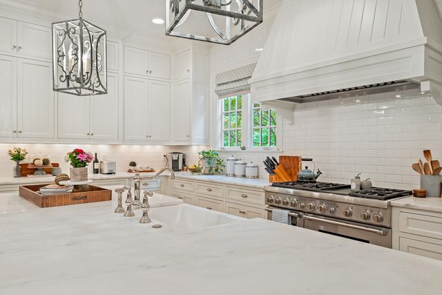 a living room with a bath tub and a glass door shower