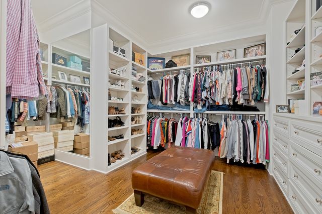 a bedroom with a bed and a table in it