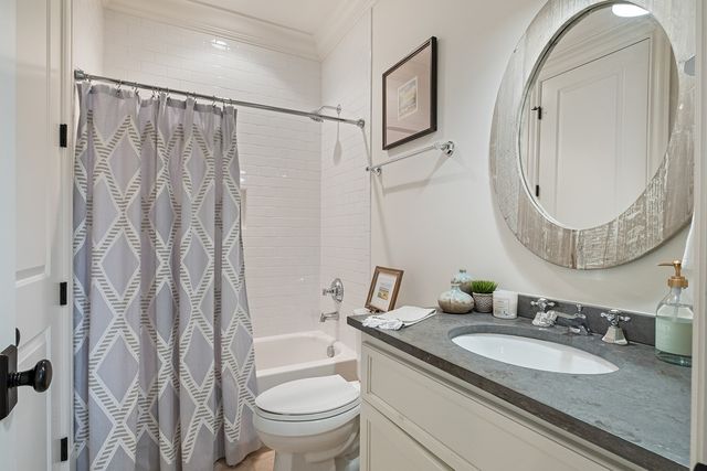 a bathroom with a sink a vanity and a mirror