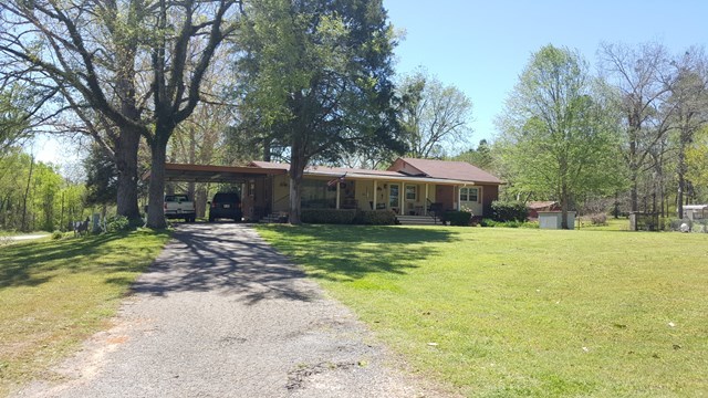 274-272 Dye Road Gray, GA 31032 - Photo 1 of 13 a front view of a house with a yard and trees