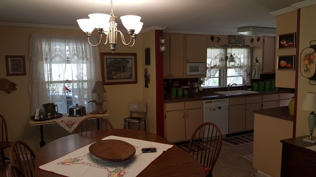 274-272 Dye Road Gray, GA 31032 - Photo 2 of 13 a view of a dining room with furniture a chandelier and window