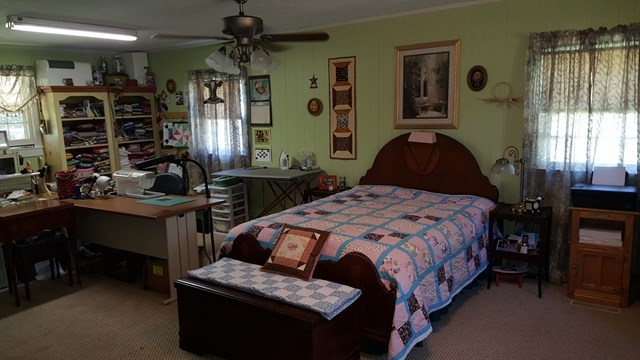 274-272 Dye Road Gray, GA 31032 - Photo 6 of 13 a bedroom with a bed wooden floor and window