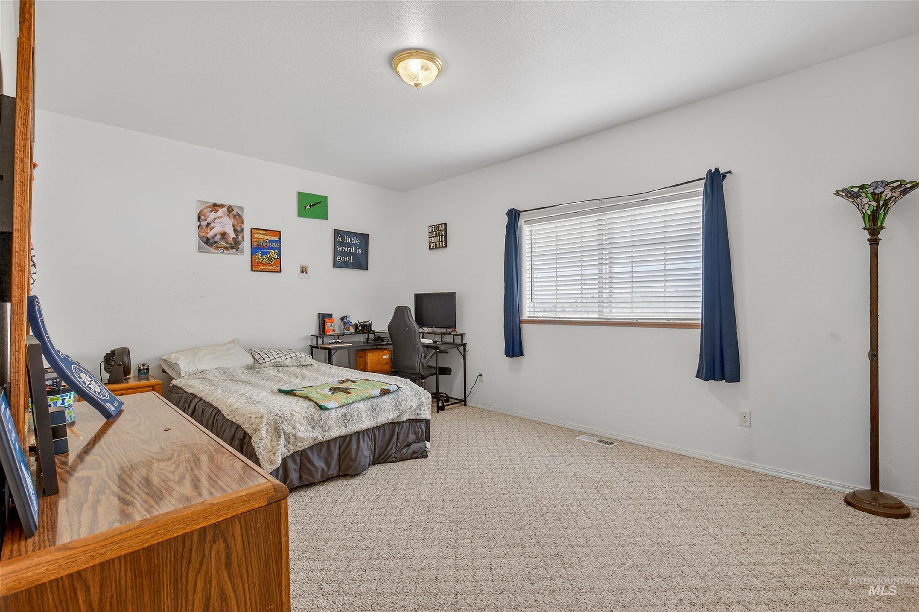 3737 19th Street Lewiston, ID 83501 - Photo 21 of 40 Carpeted bedroom with a desk and baseboards