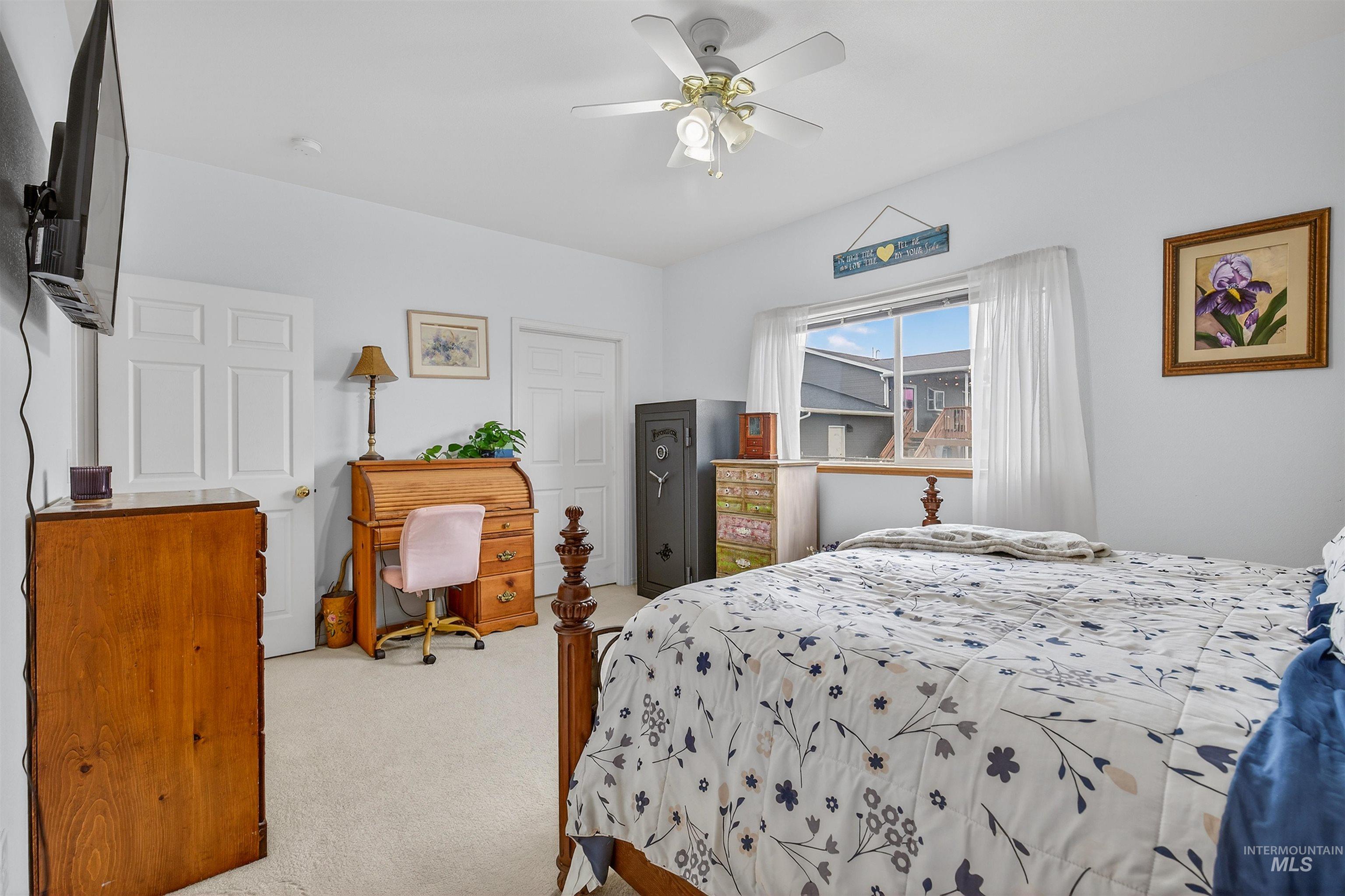 3737 19th Street Lewiston, ID 83501 - Photo 26 of 40 Bedroom with light colored carpet and a ceiling fan