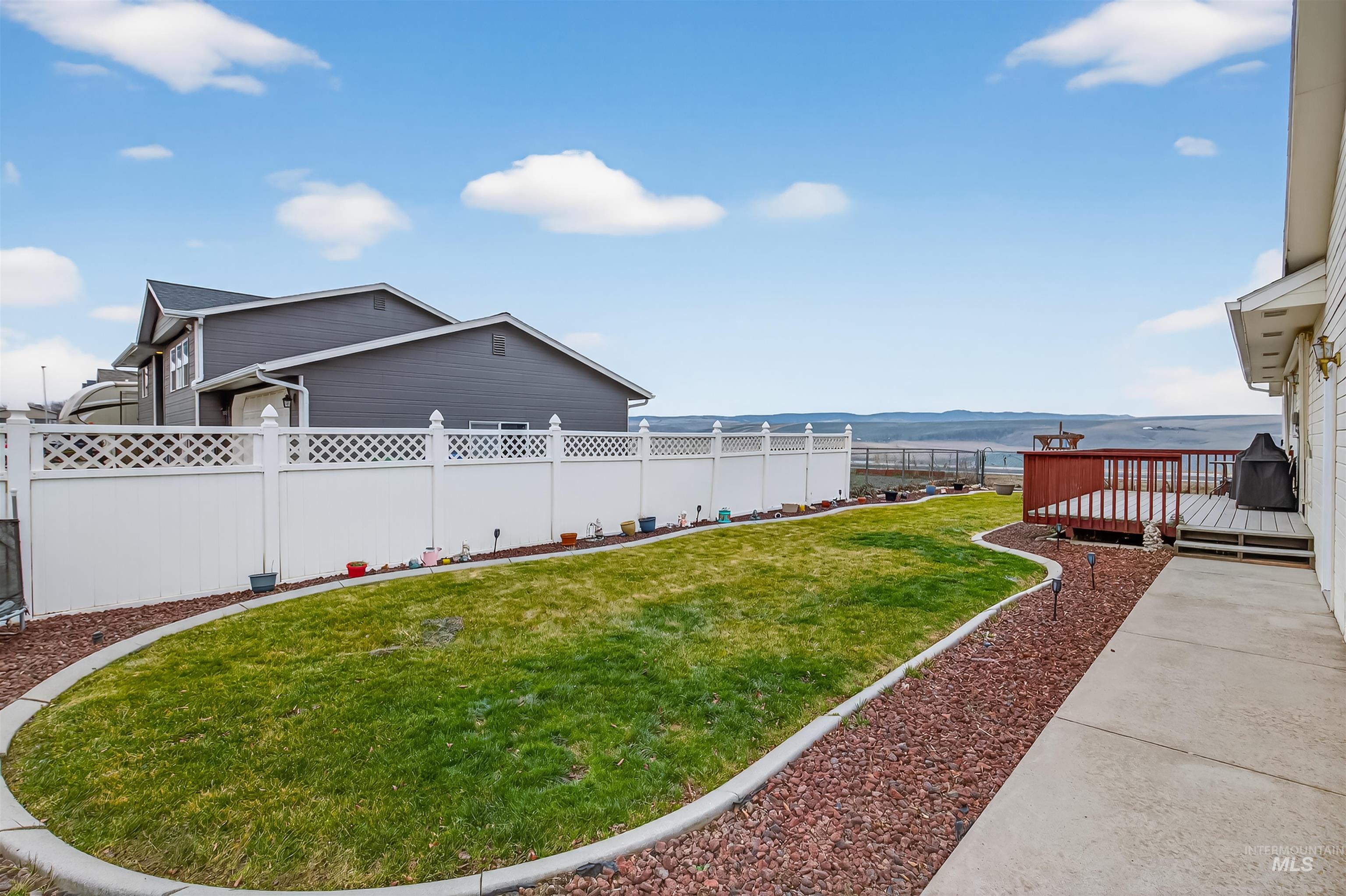 3737 19th Street Lewiston, ID 83501 - Photo 30 of 40 Fenced backyard featuring a deck with mountain view