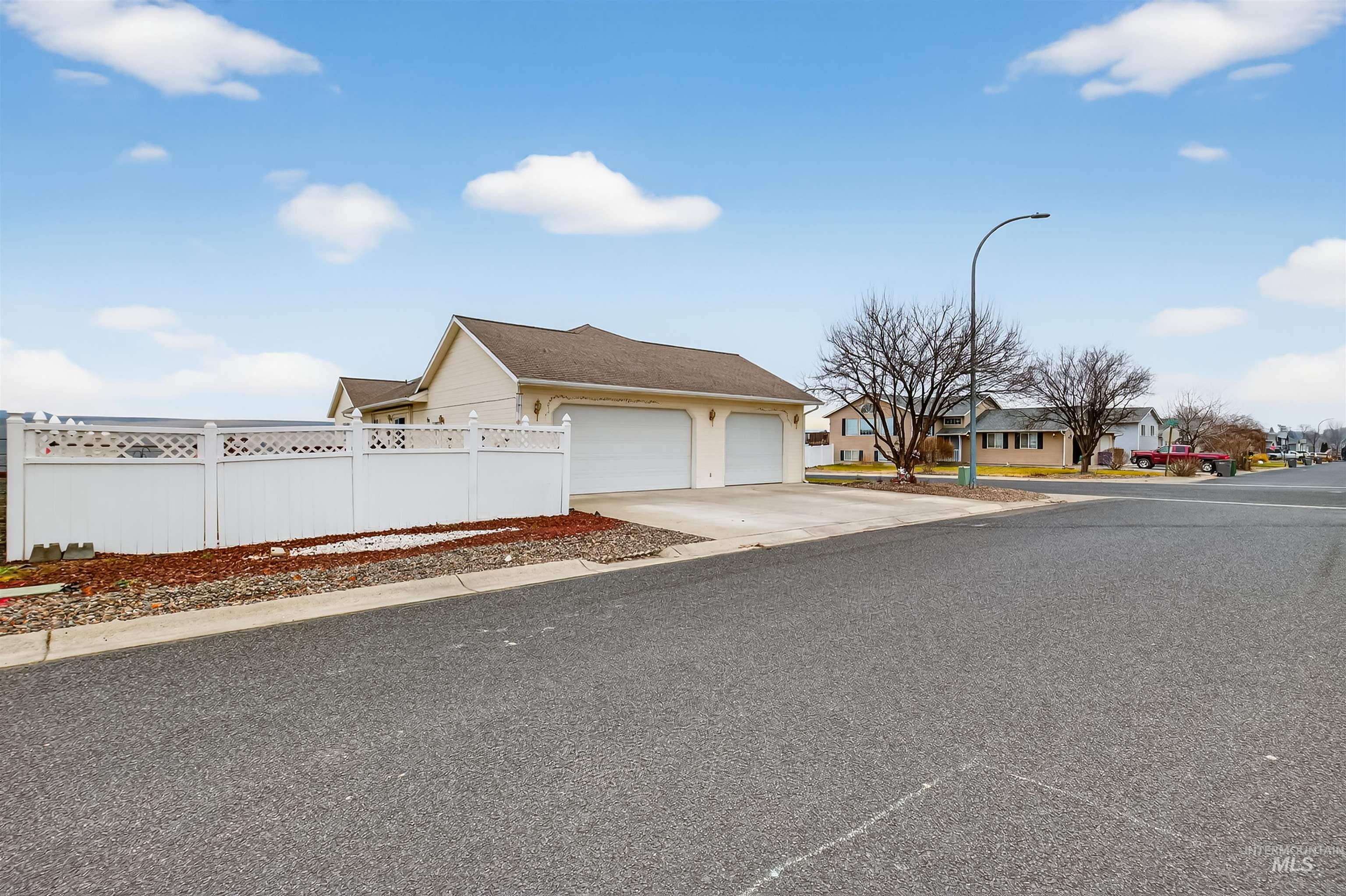 3737 19th Street Lewiston, ID 83501 - Photo 3 of 40 View of front of home with driveway, an attached garage, and a residential view