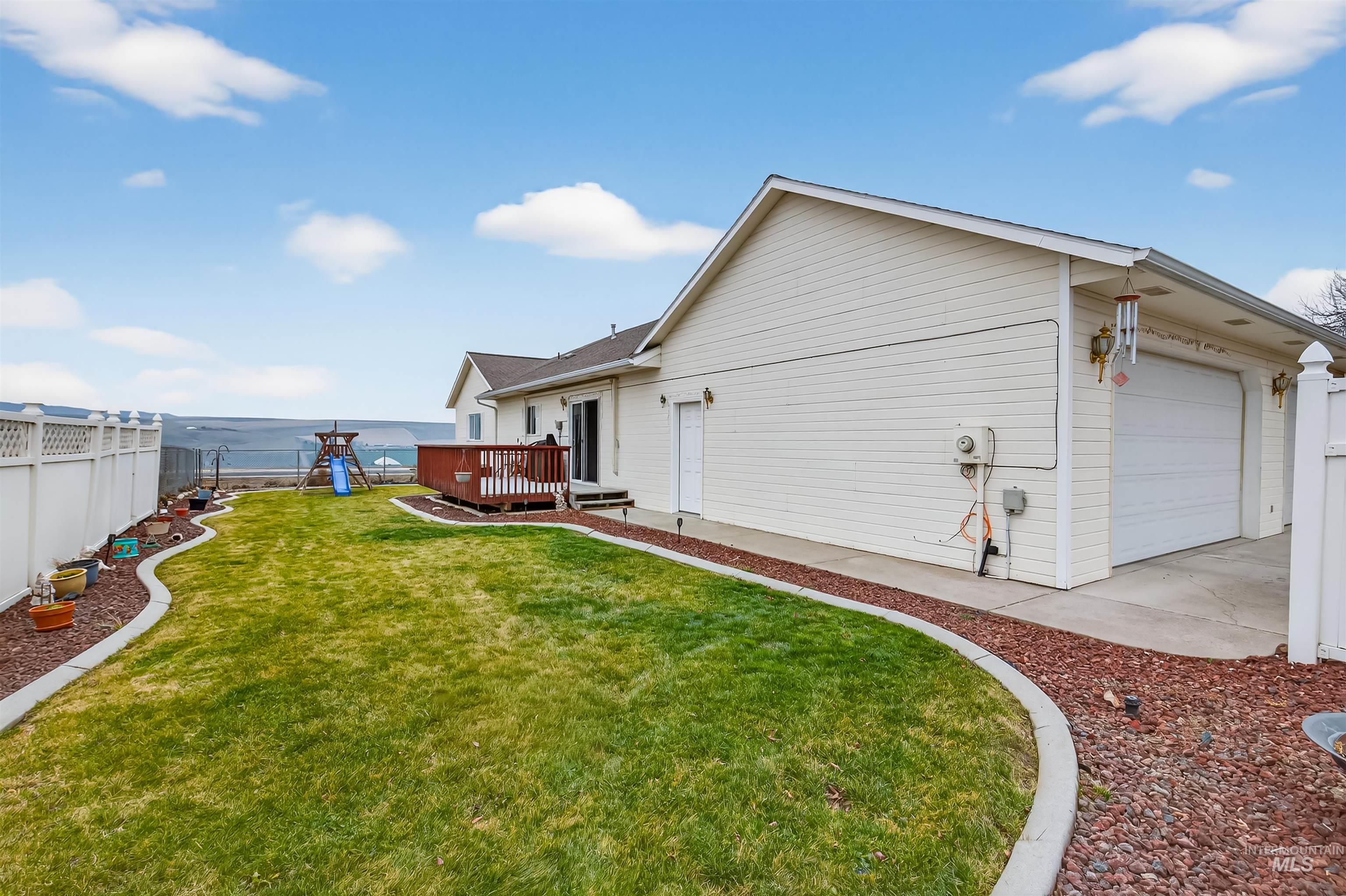 3737 19th Street Lewiston, ID 83501 - Photo 31 of 40 Fenced yard with a playground and a wooden deck