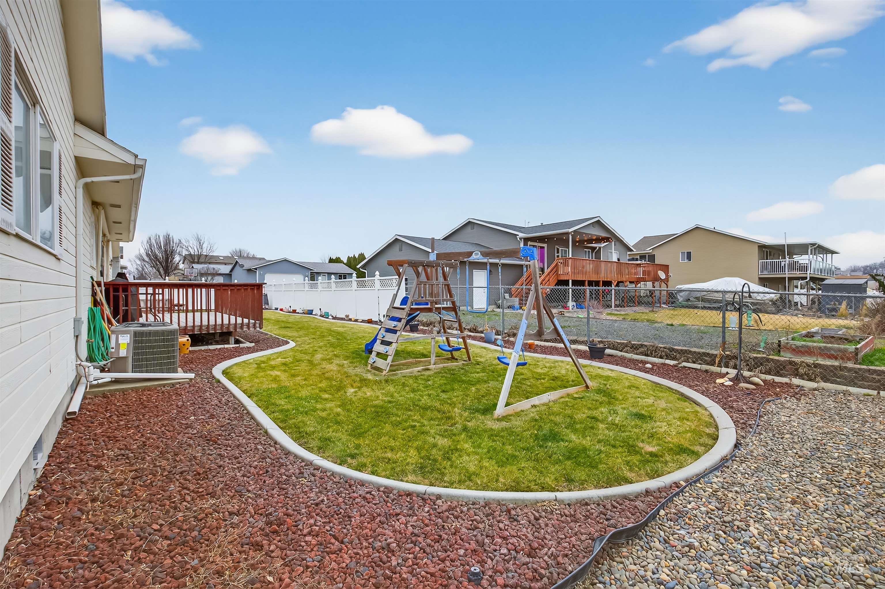 3737 19th Street Lewiston, ID 83501 - Photo 33 of 40 Fenced backyard with a playground and a residential view