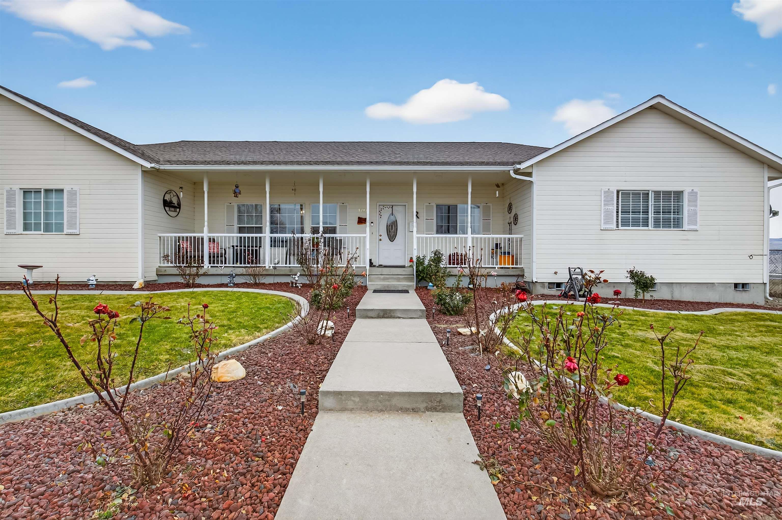 3737 19th Street Lewiston, ID 83501 - Photo 36 of 40 View of front of home with a front lawn, covered porch, and roof with shingles