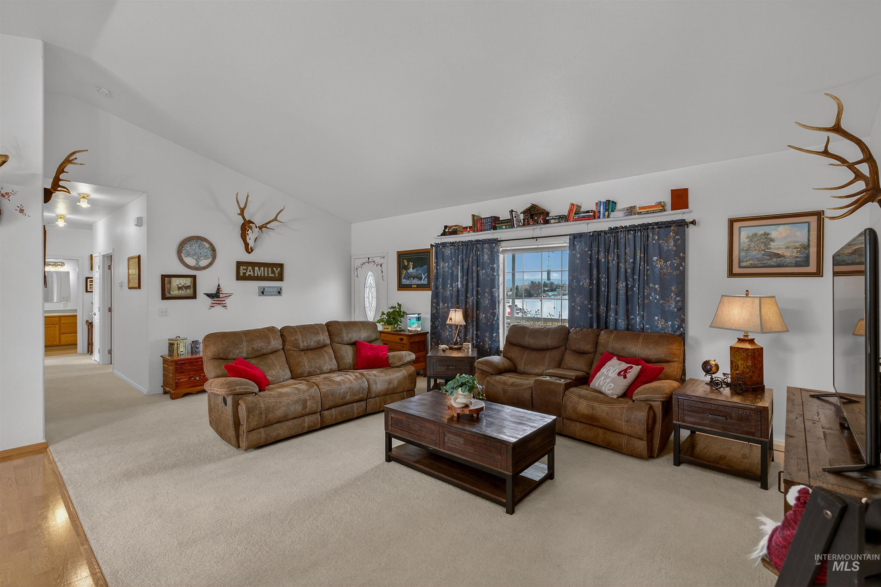 3737 19th Street Lewiston, ID 83501 - Photo 7 of 40 Living room with carpet flooring and lofted ceiling