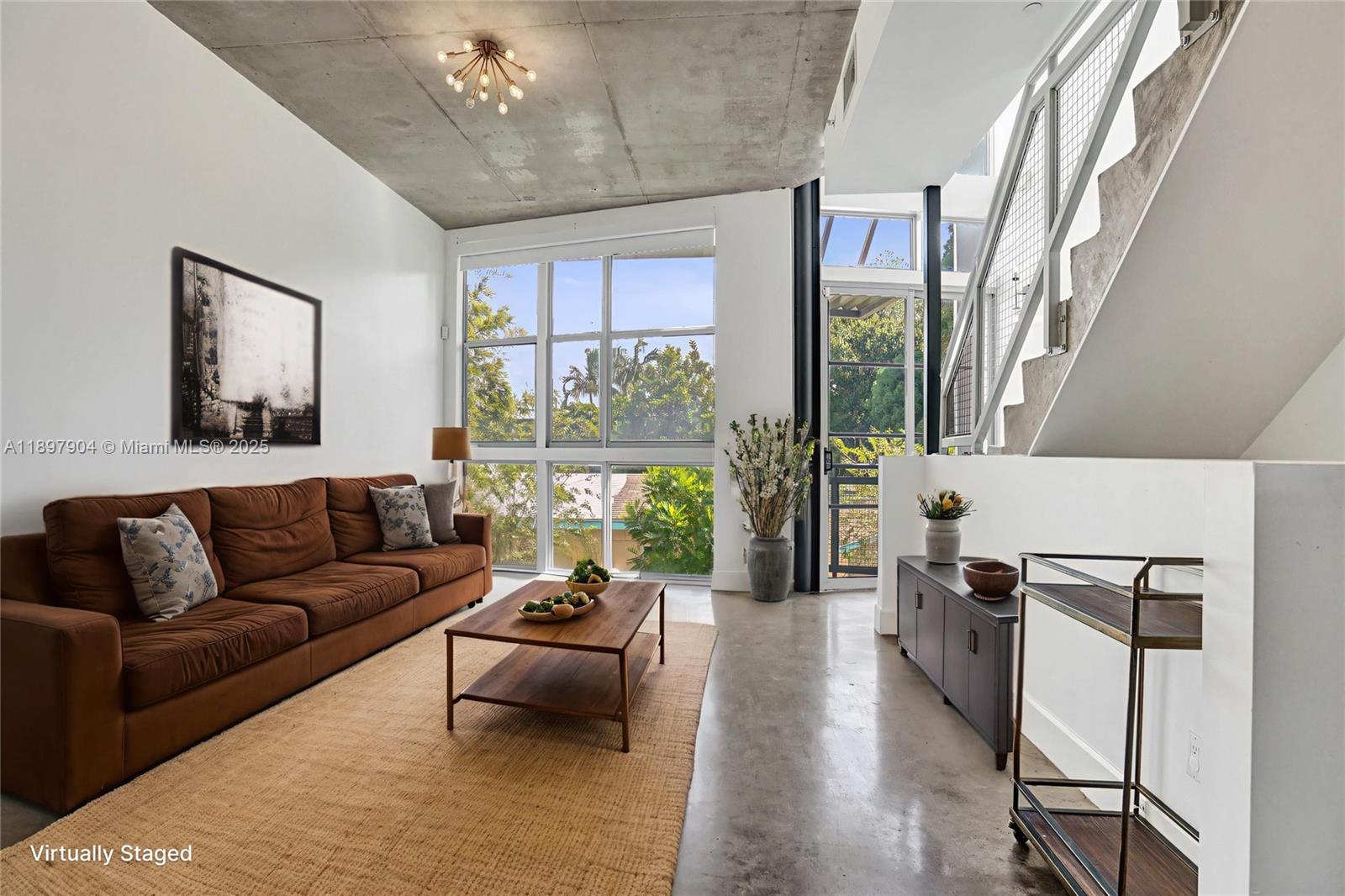 716 Southeast 12th Street, Unit 13 Fort Lauderdale, FL 33316 - Photo 2 of 45 a living room with furniture and a large window