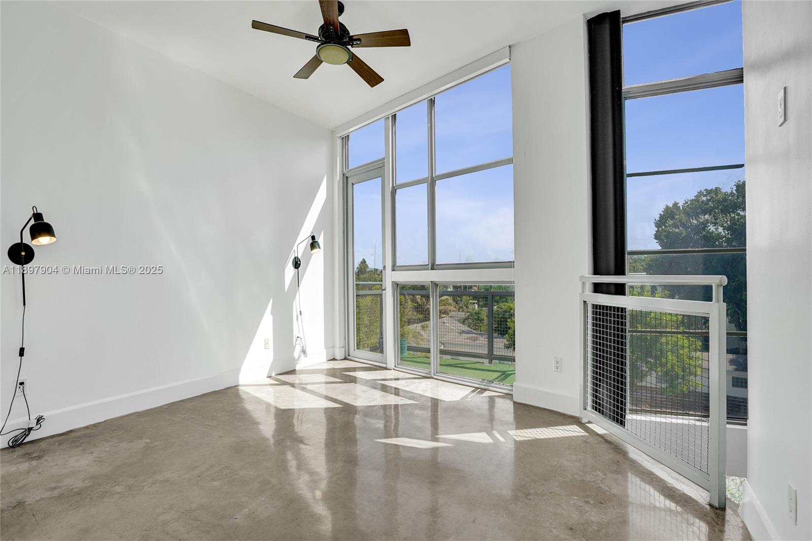 716 Southeast 12th Street, Unit 13 Fort Lauderdale, FL 33316 - Photo 21 of 45 a view of an empty room with a window
