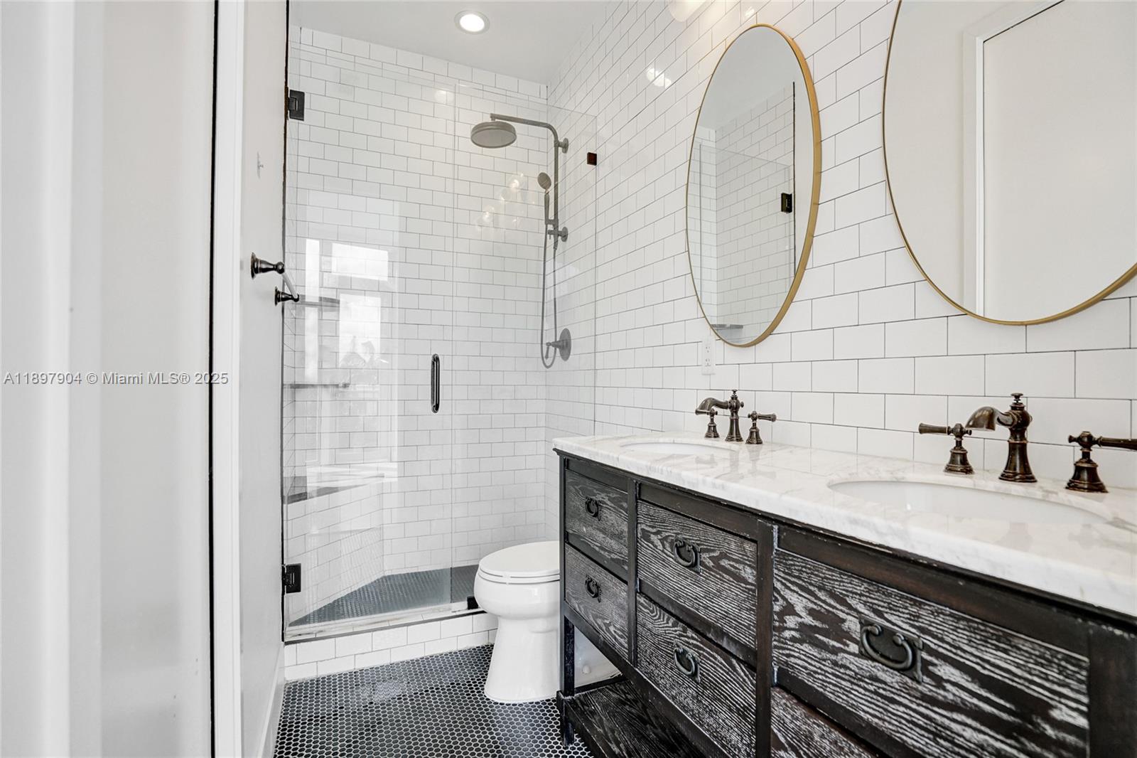 716 Southeast 12th Street, Unit 13 Fort Lauderdale, FL 33316 - Photo 22 of 45 a bathroom with a double vanity sink mirror and toilet