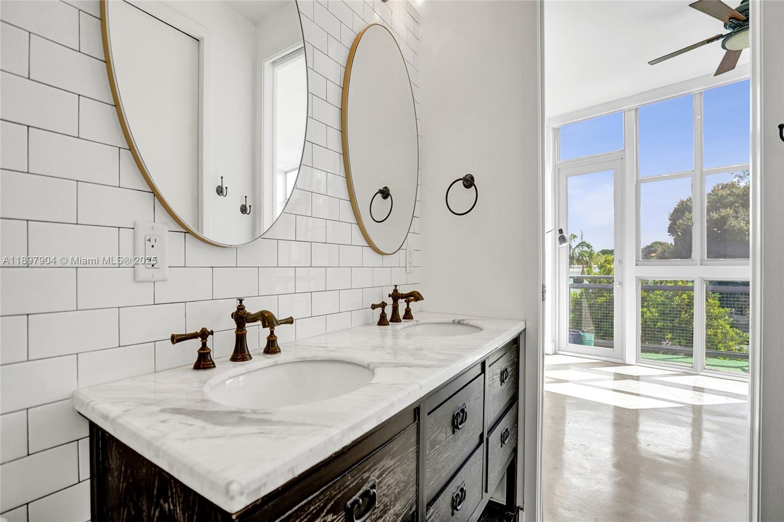 716 Southeast 12th Street, Unit 13 Fort Lauderdale, FL 33316 - Photo 24 of 45 a bathroom with a sink and a mirror