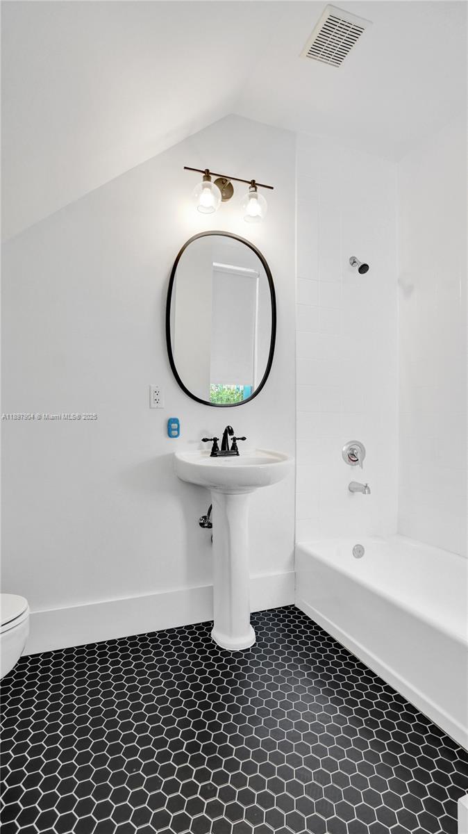 716 Southeast 12th Street, Unit 13 Fort Lauderdale, FL 33316 - Photo 28 of 45 a bathroom with a sink and a mirror