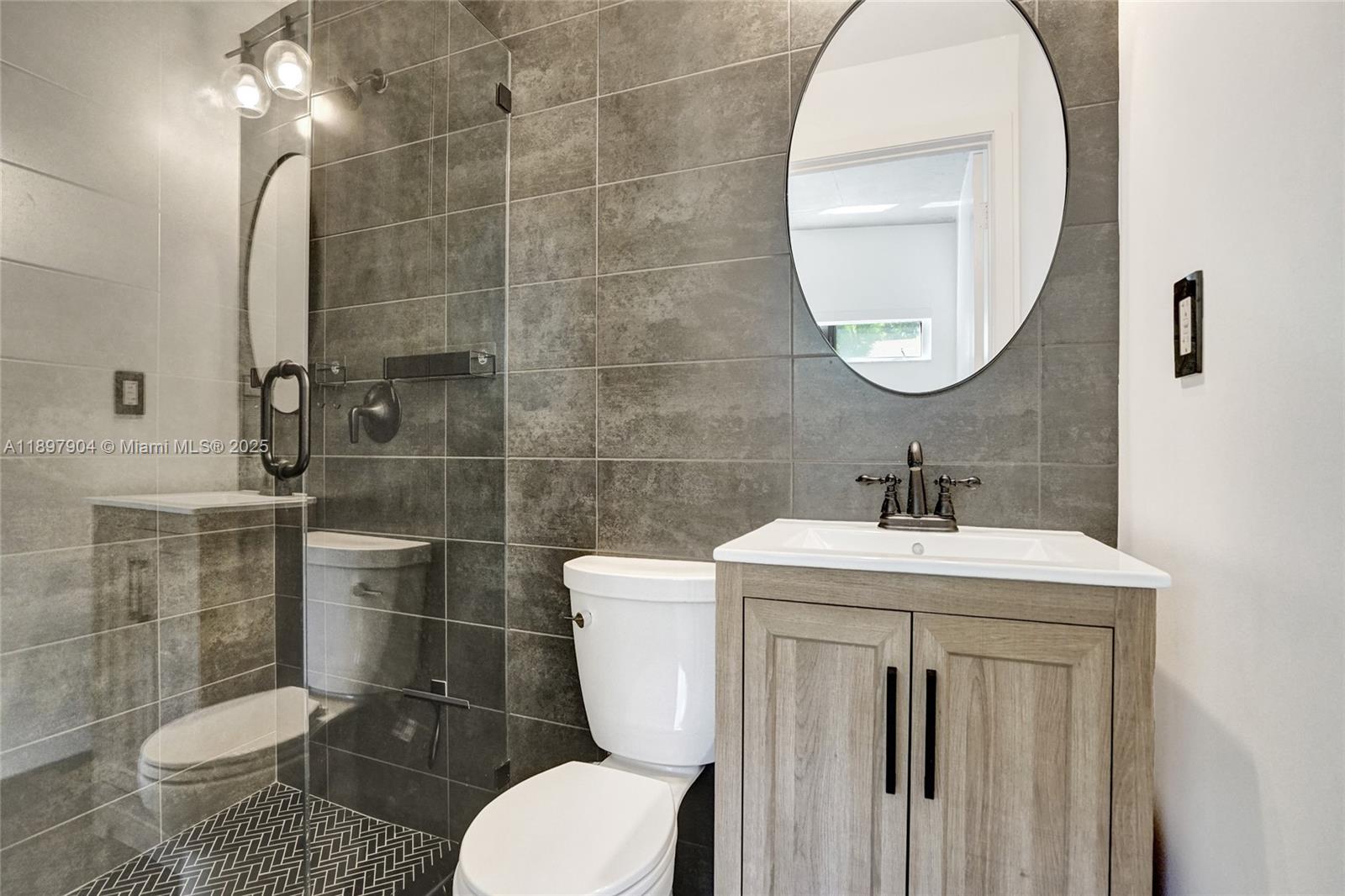 716 Southeast 12th Street, Unit 13 Fort Lauderdale, FL 33316 - Photo 33 of 45 a bathroom with a toilet a sink and mirror